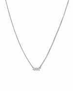 Sterling silver angel number 444 necklace by Sami Jewels, featuring a delicate pendant on a chain against a white background.