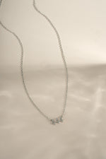 Sterling silver Angel Number 444 necklace by Sami Jewels featuring a delicate chain and engraved numerals.