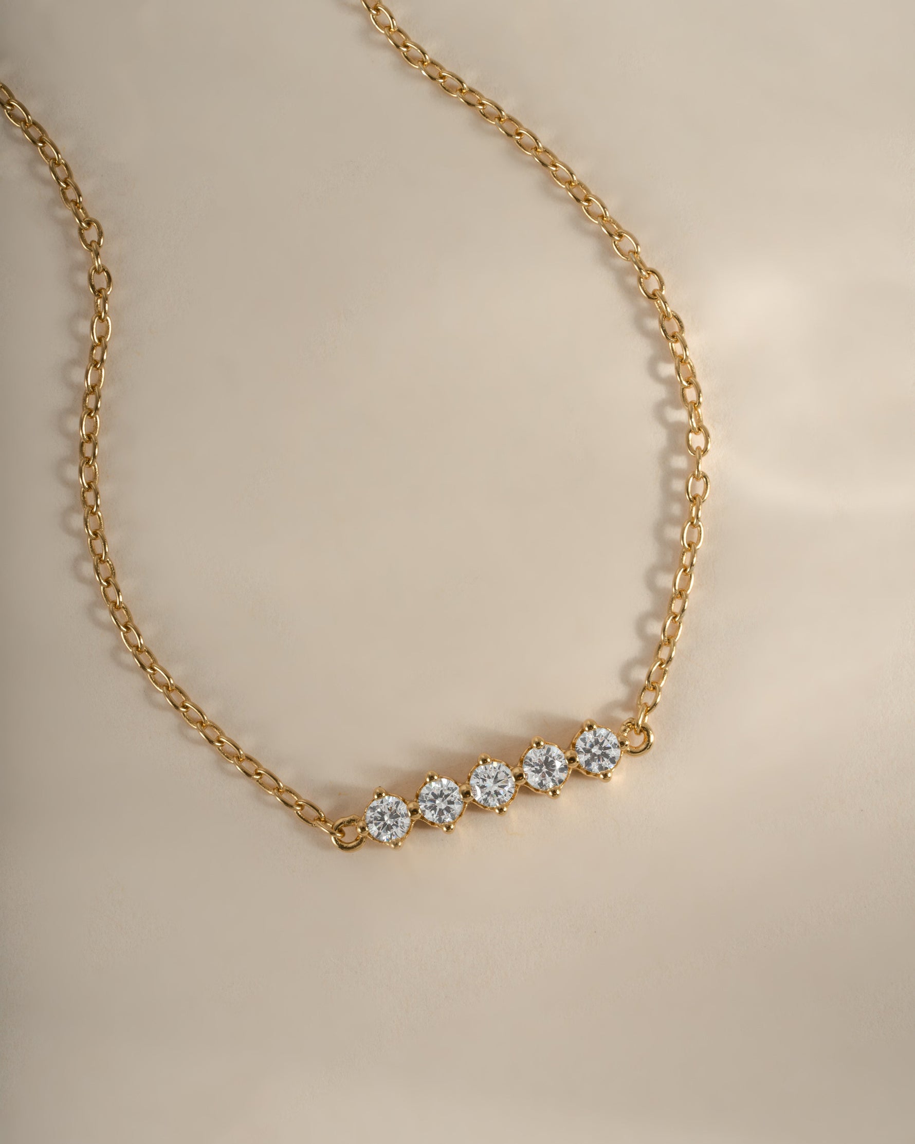 Close-up of Sami Jewels 5-stone diamond bracelet in gold, showcasing sparkling diamonds and elegant design.