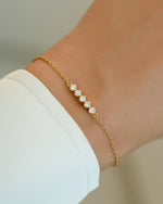 Gold 5-stone diamond bracelet by Sami Jewels featuring sparkling diamonds on a delicate chain.