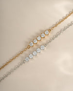 Sterling silver bracelet featuring five sparkling diamond stones, crafted by Sami Jewels with a sleek gold-tone finish.