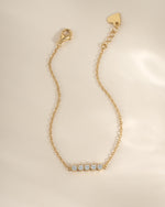 Gold 5-stone diamond bracelet by Sami Jewels featuring sparkling diamonds set in a elegant bracelet design.
