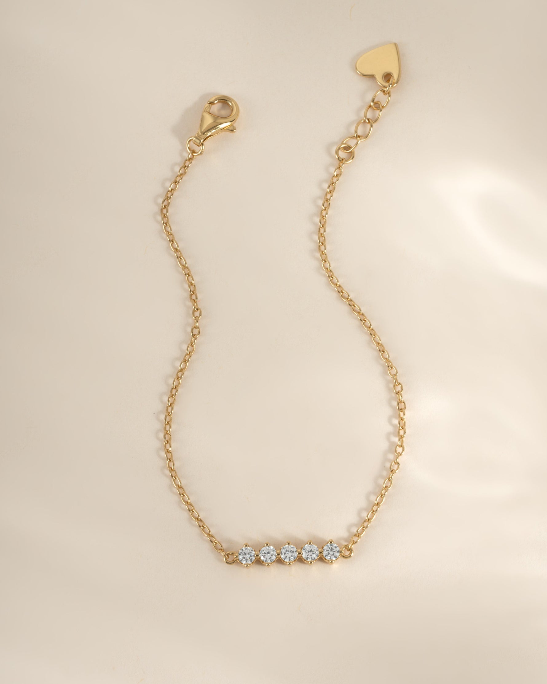 Gold 5-stone diamond bracelet by Sami Jewels featuring sparkling diamonds set in a elegant bracelet design.