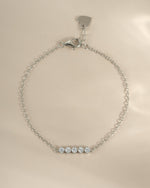 Sterling silver 5-stone diamond bracelet by Sami Jewels, showcasing sparkling diamonds and a sleek, elegant design.
