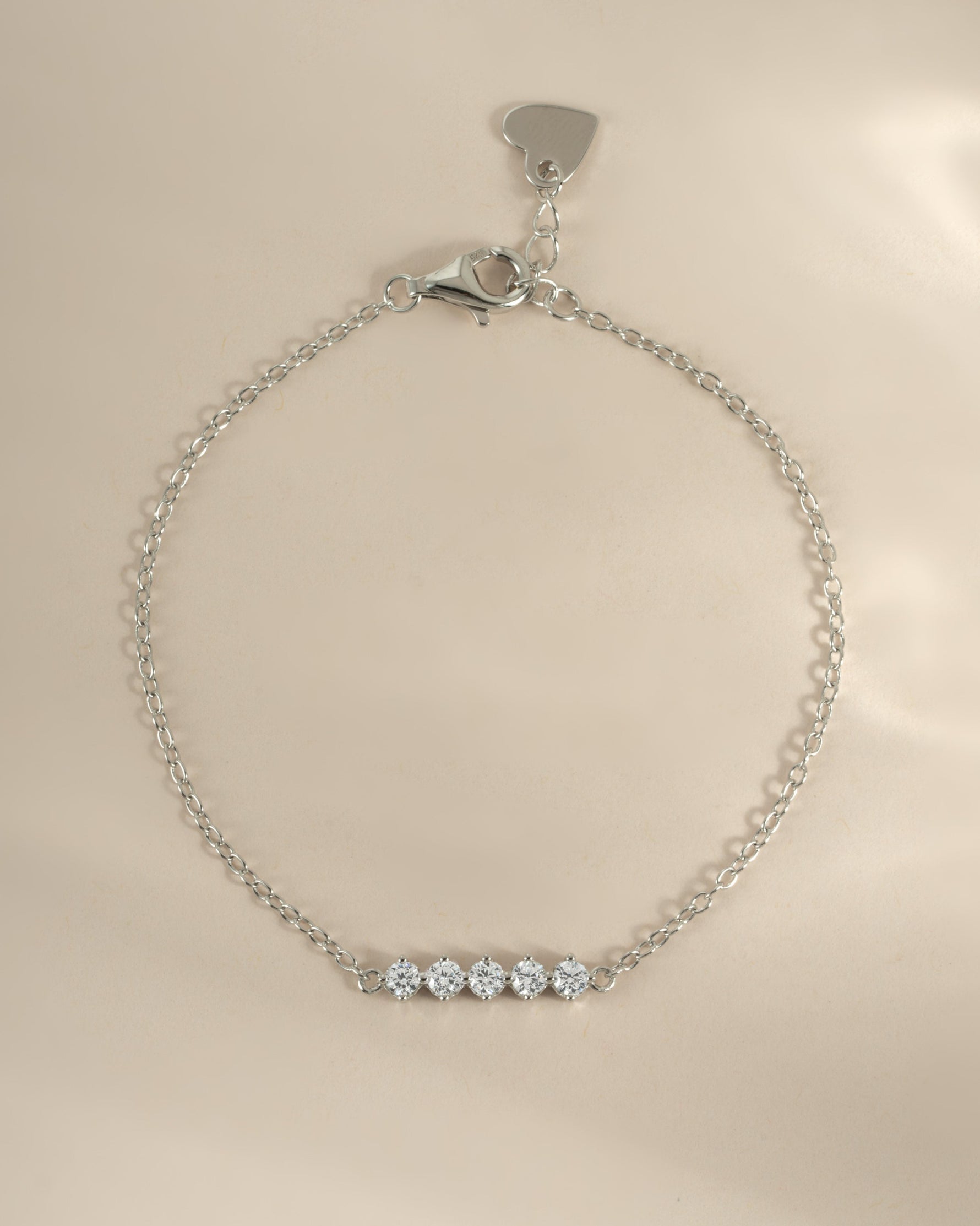 Sterling silver 5-stone diamond bracelet by Sami Jewels, showcasing sparkling diamonds and a sleek, elegant design.