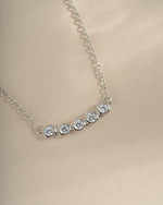 Close-up of Sami Jewels Five Stone Bar Necklace featuring five sparkling diamonds on a sleek sterling silver chain.