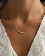 Sterling silver five-stone diamond necklace by Sami Jewels featuring a row of sparkling gemstones on a delicate chain.