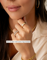 5mm gold multistone ring stacked with 4mm gold multi stone ring on models hand