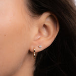 Dainty Heart Hoop Earrings and diamond stud earrings on model