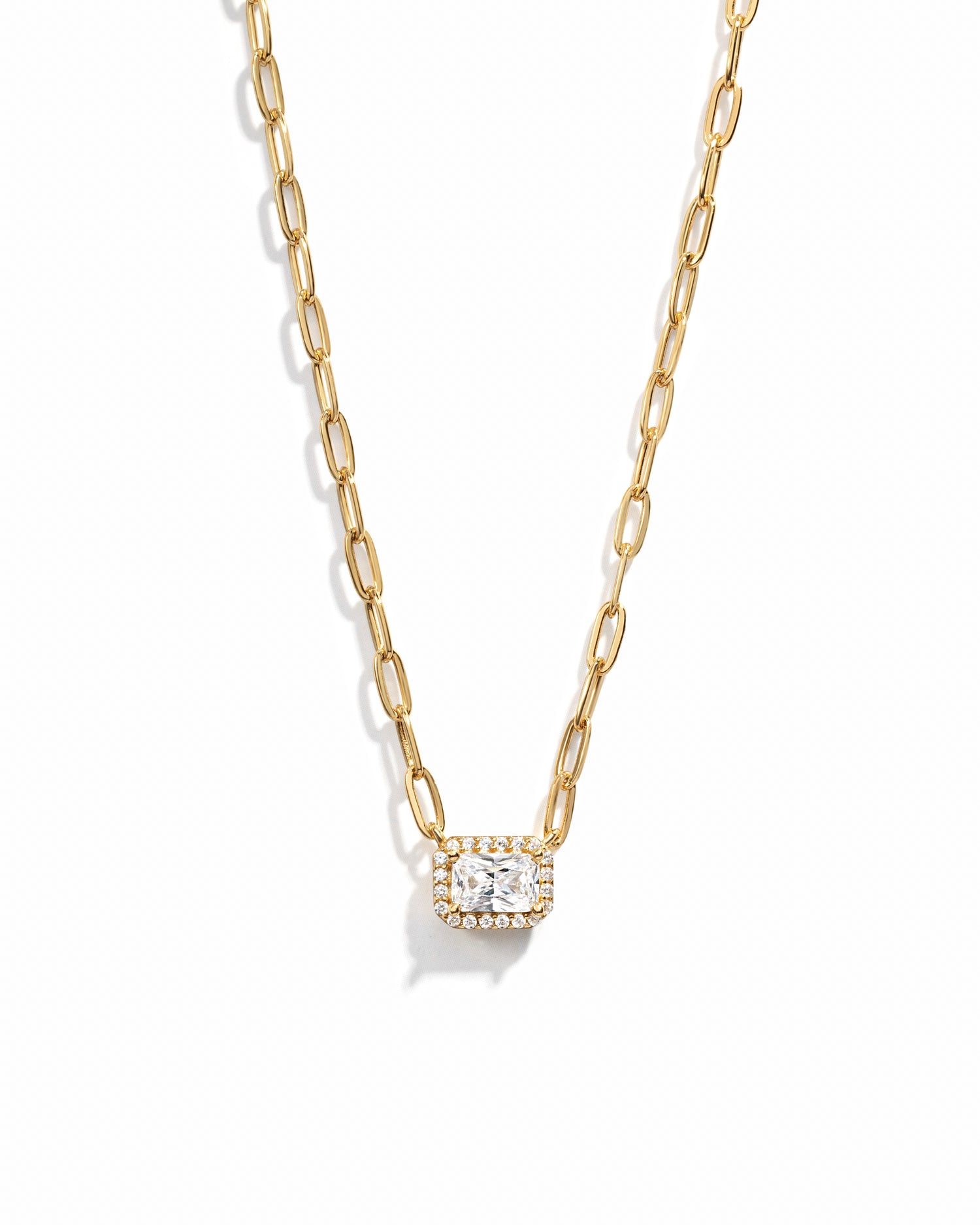 closeup image of gold pendant necklace