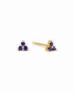 Dainty gold sapphire stud earrings.