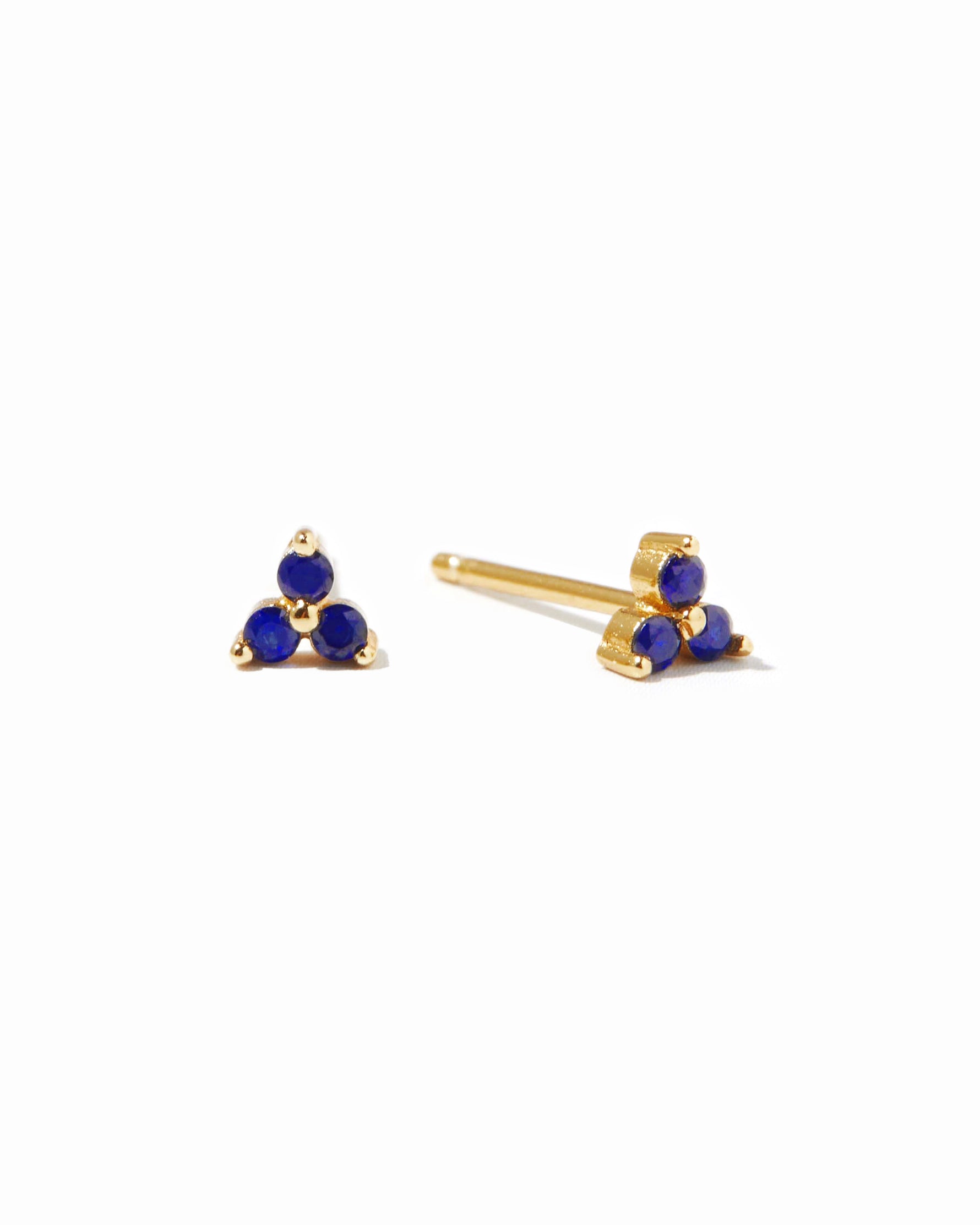 Dainty gold sapphire stud earrings.