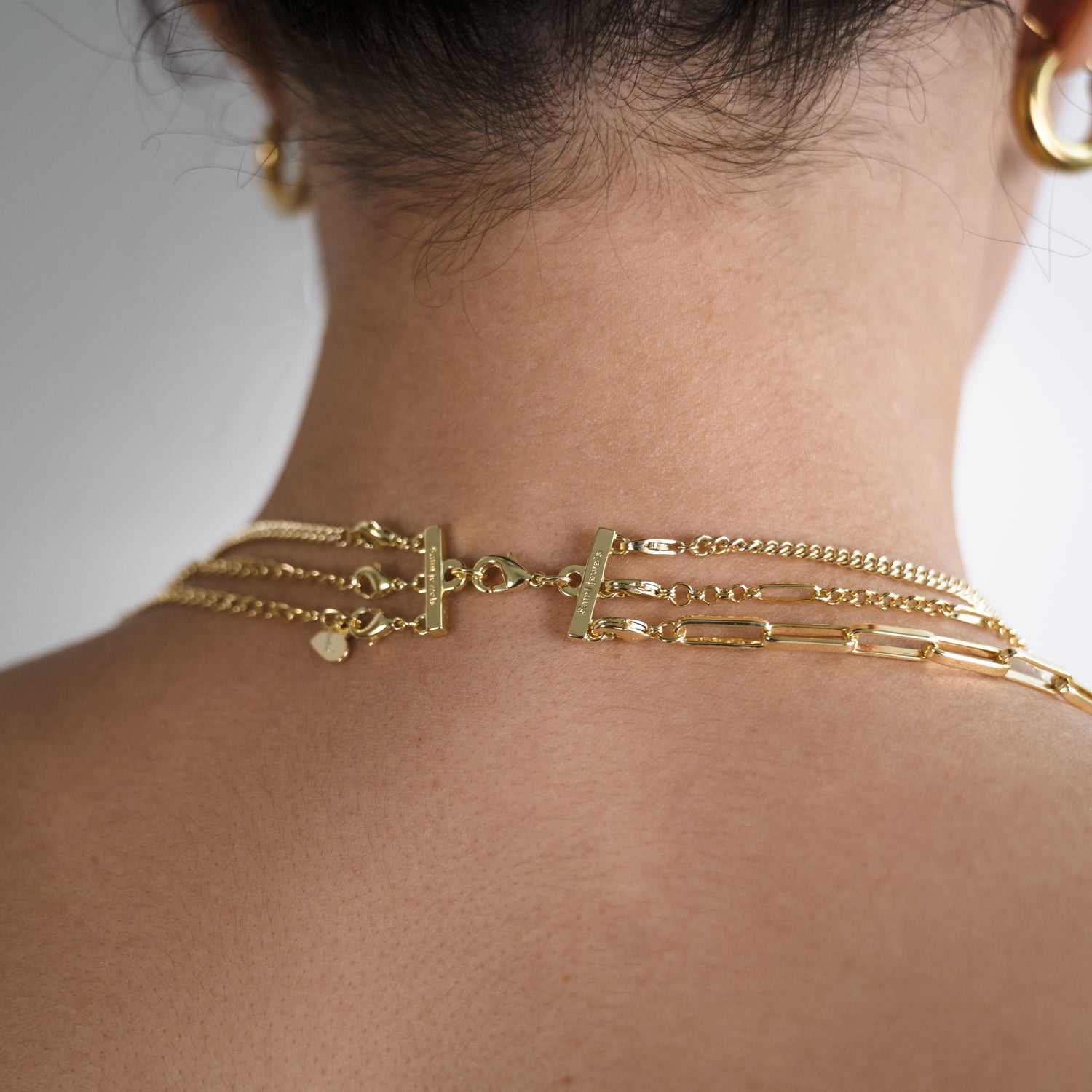 gold necklace layering clasp on model