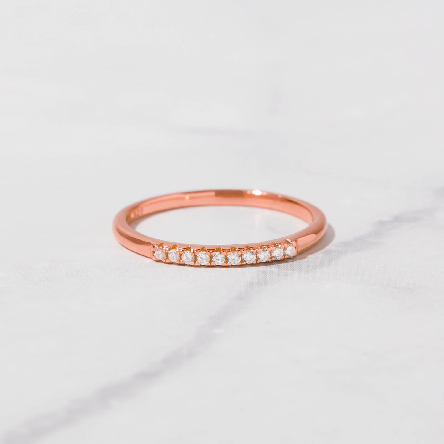 Stacked pavé rings by Sami Jewels featuring sparkling diamond accents on sleek gold bands.