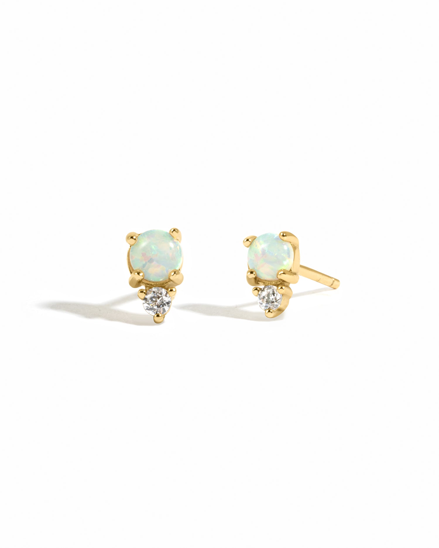 Dainty gold stud with opal and cubic zirconia.