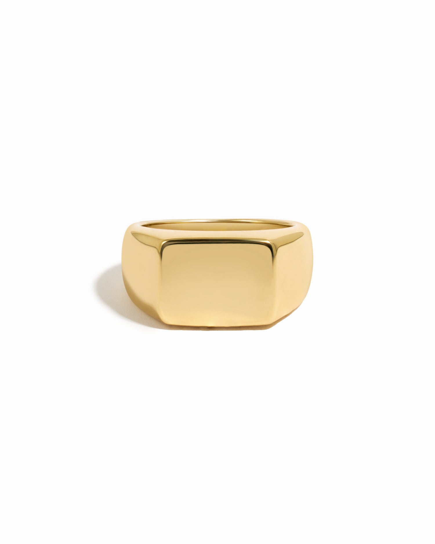 Chunky gold square signet statement ring.
