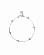 A sterling silver chain bracelet with purple opal beads.