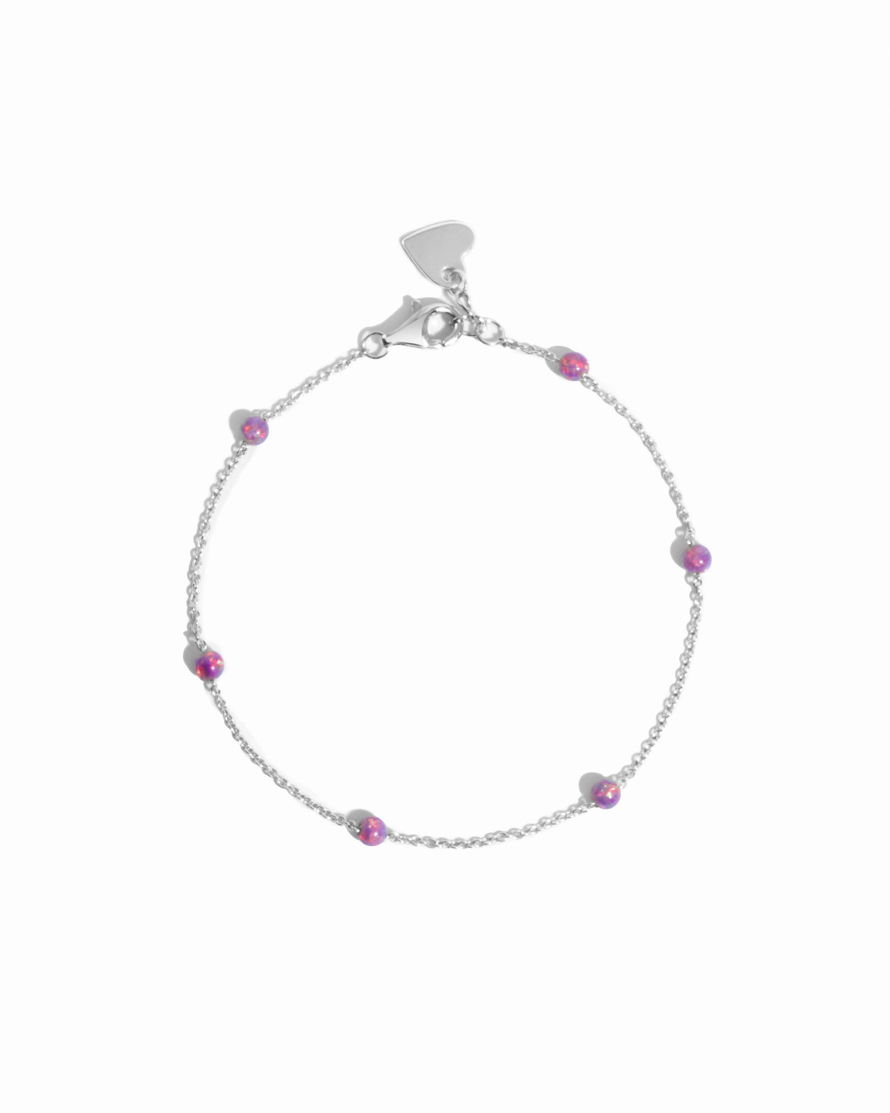A sterling silver chain bracelet with purple opal beads.