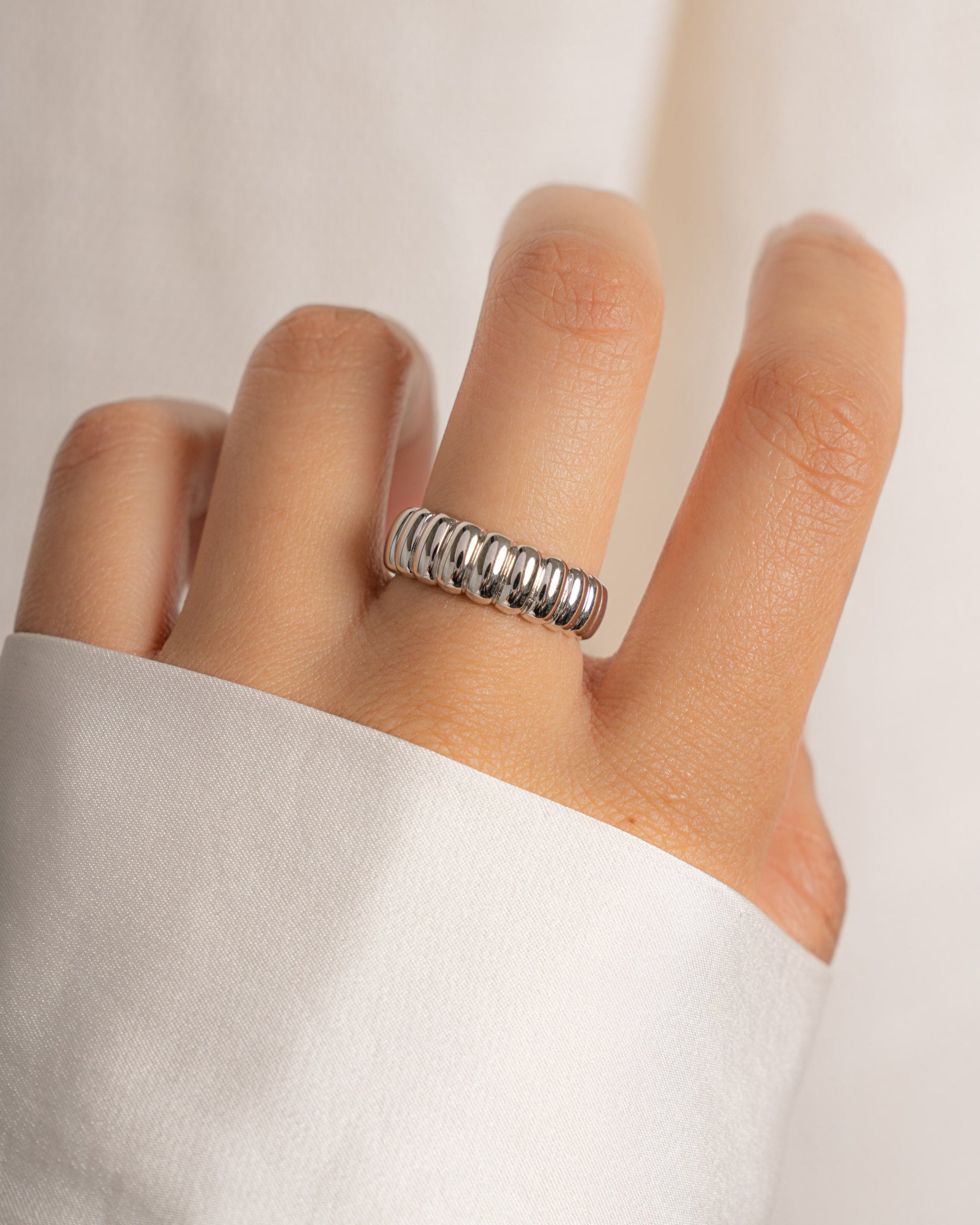 Sterling silver chunky fluted statement ring on a model.