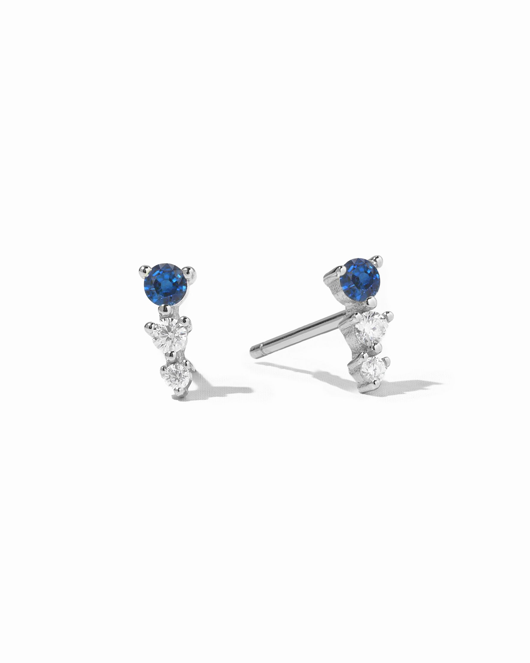 Sterling silver ear climber studs with sapphire and diamond stones.