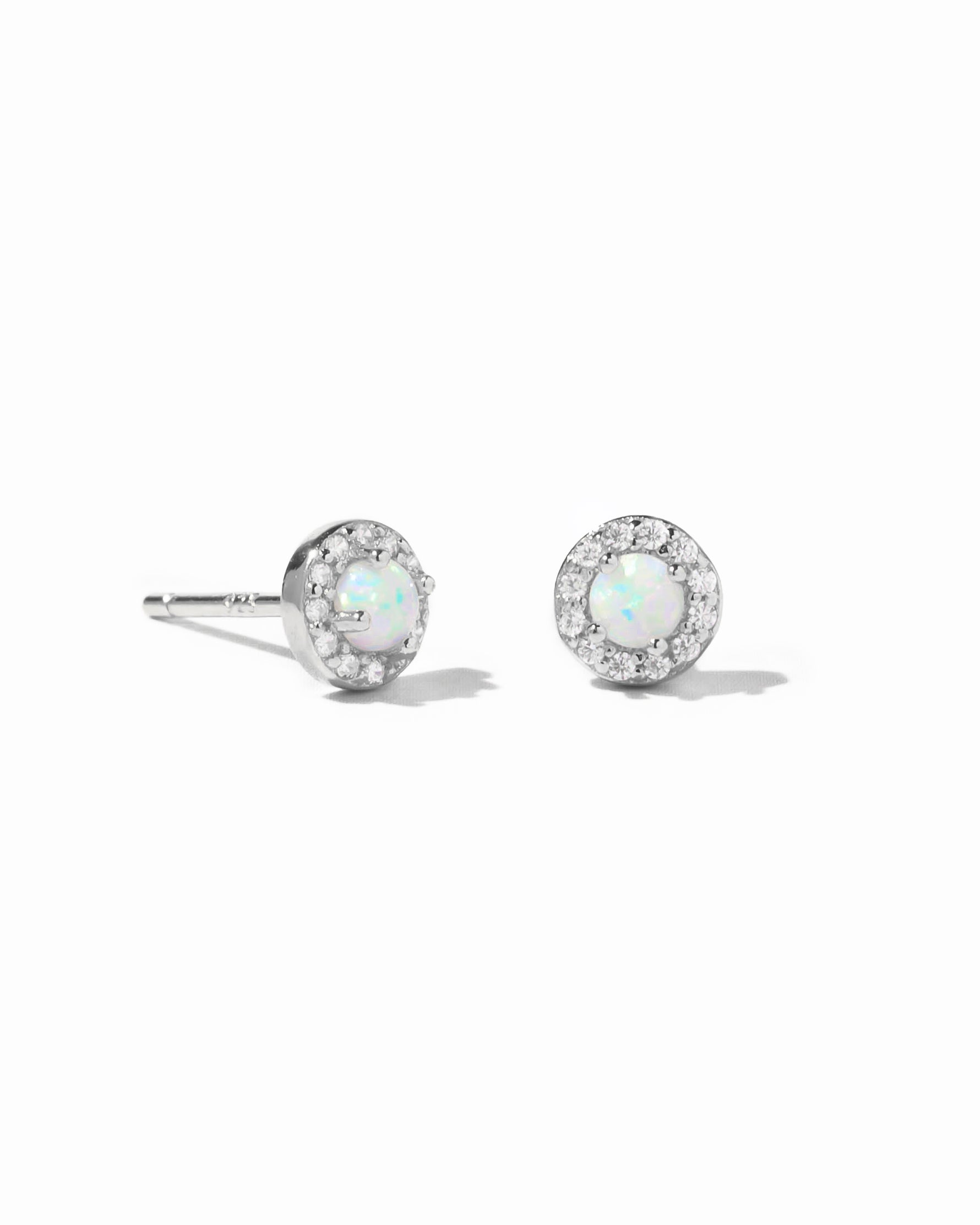 Dainty sterling silver opal stud earrings.