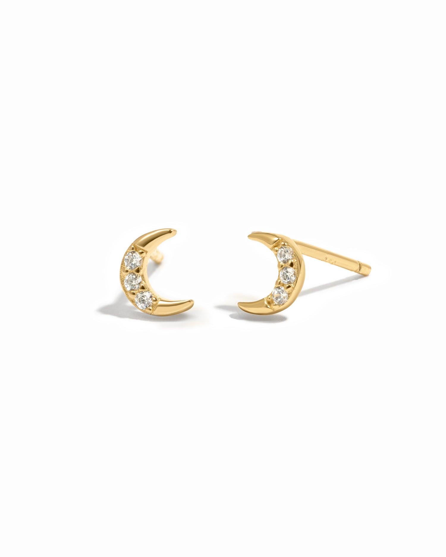 Gold moon stud earrings with 3 diamond stones.