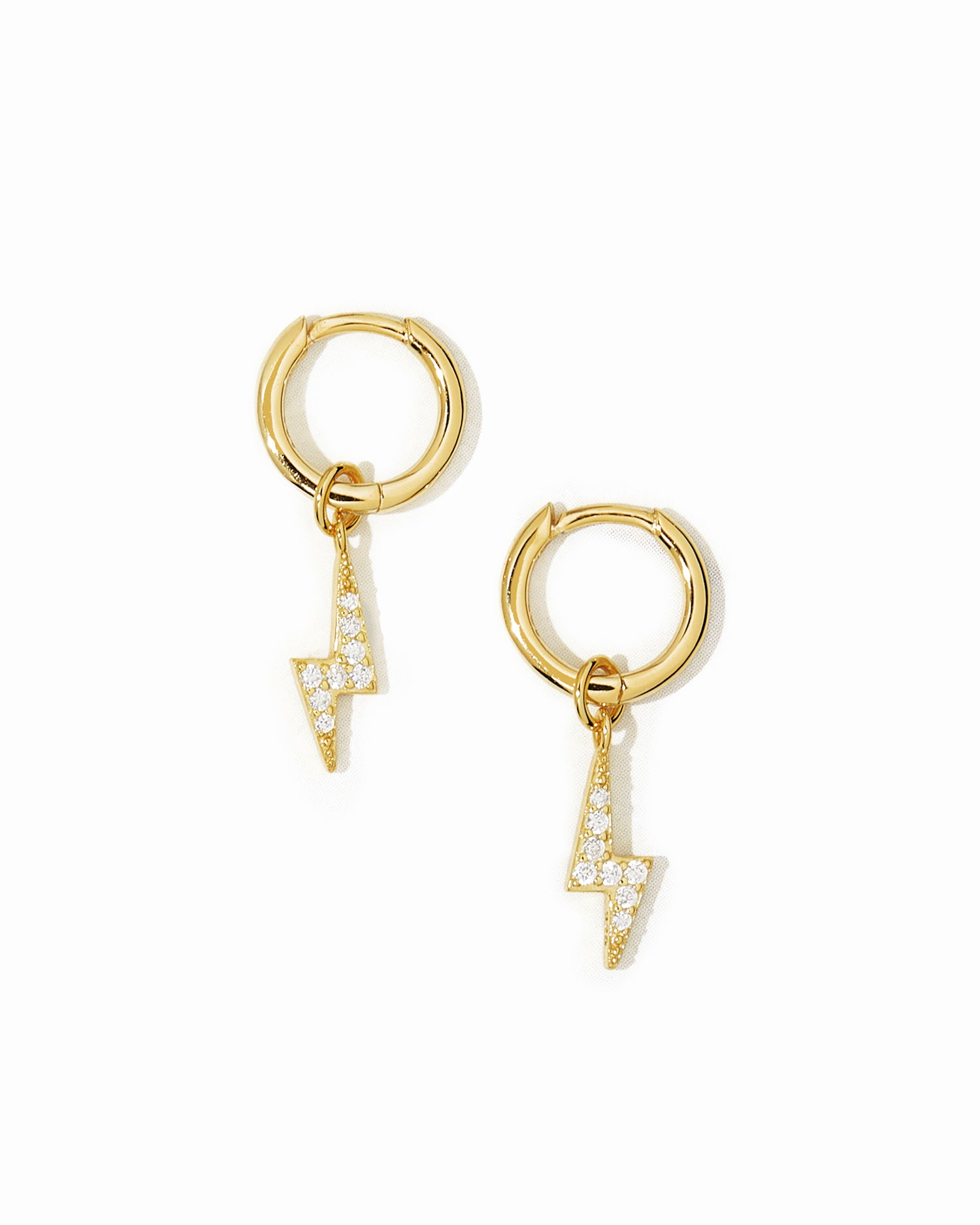 Gold dainty huggies with lightning bolt charm.