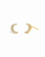 Gold diamond studded moon earrings.