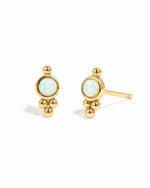 Gold beaded stud earrings with opal charm.