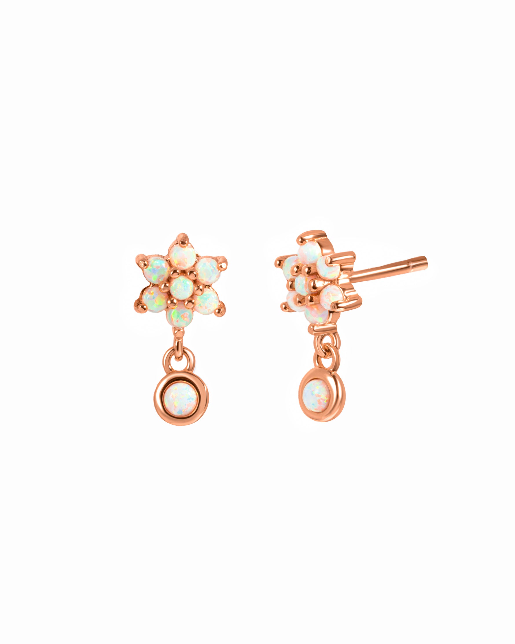 Dangling rose gold opal floral stud earrings.