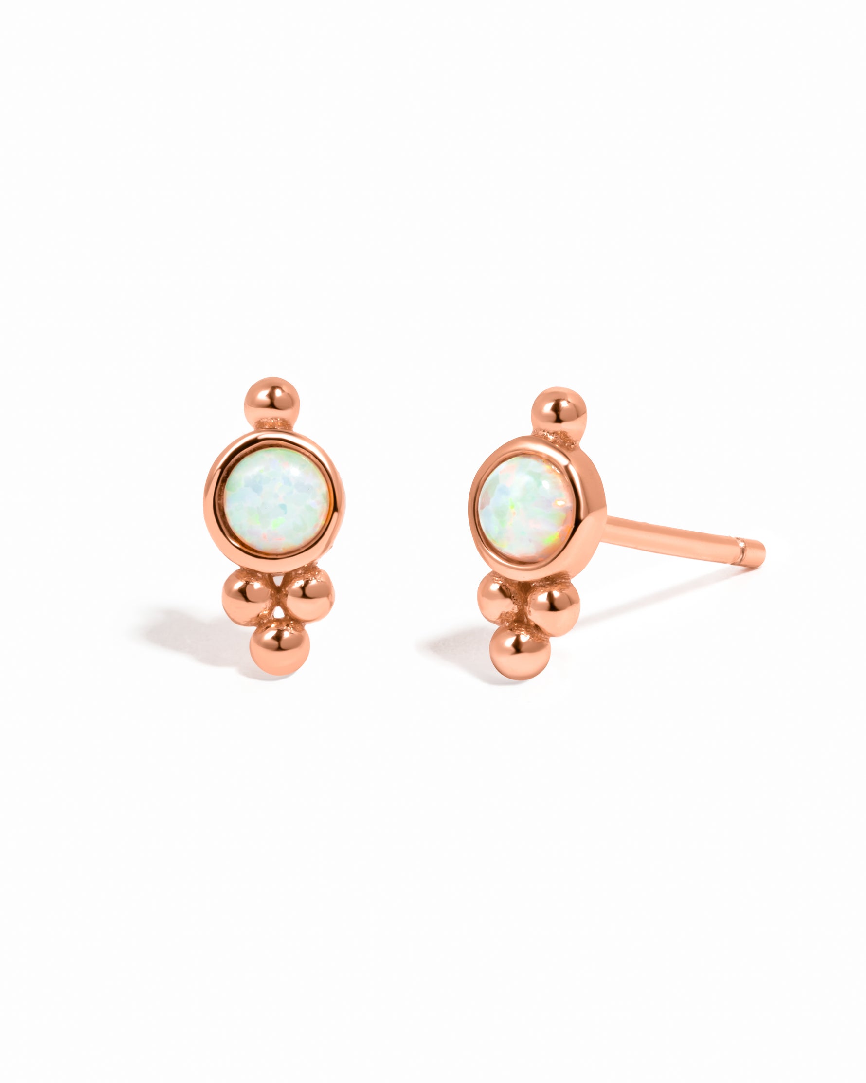 Rose gold dainty beaded earrings with opal center. 