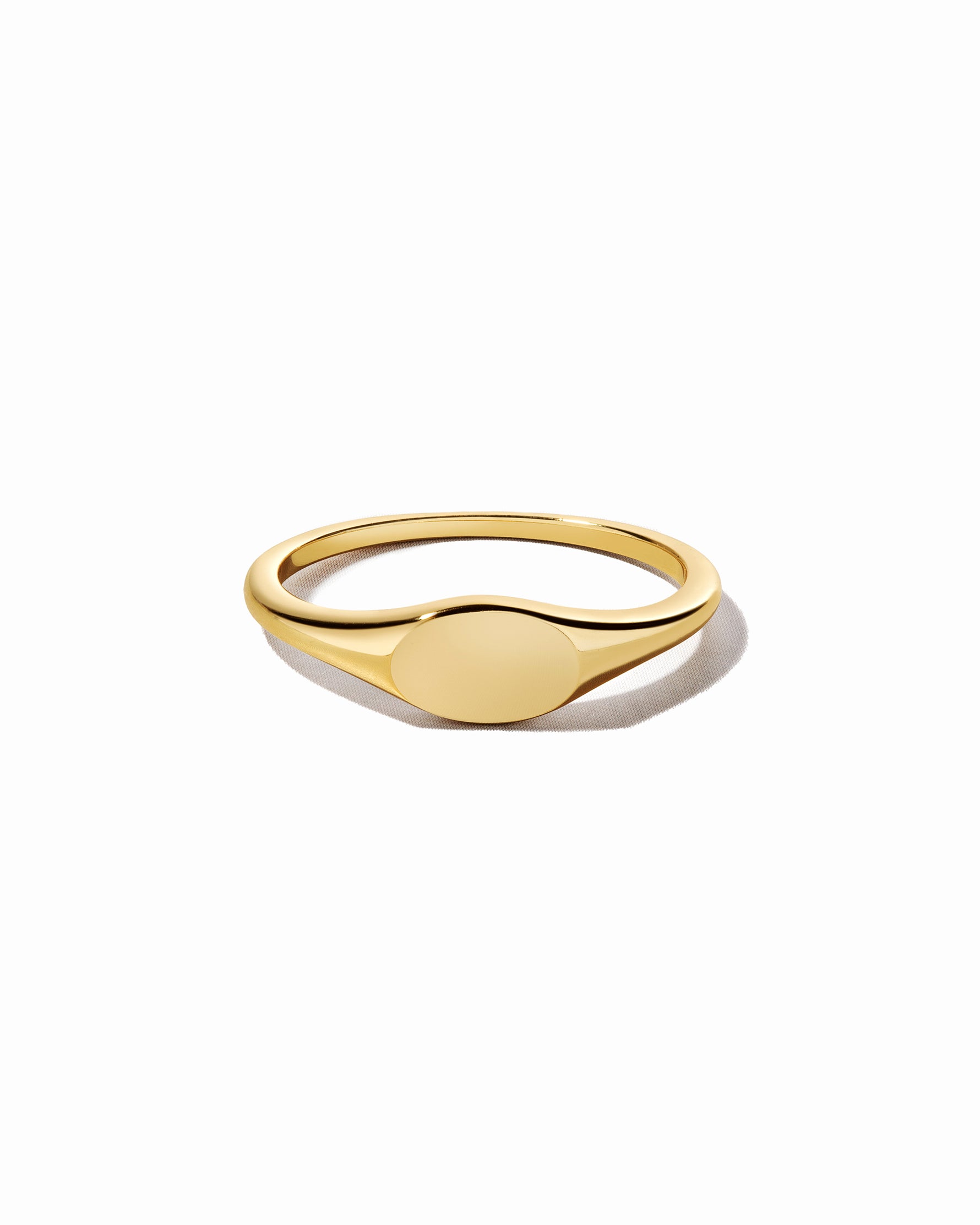 Gold dainty signet ring.