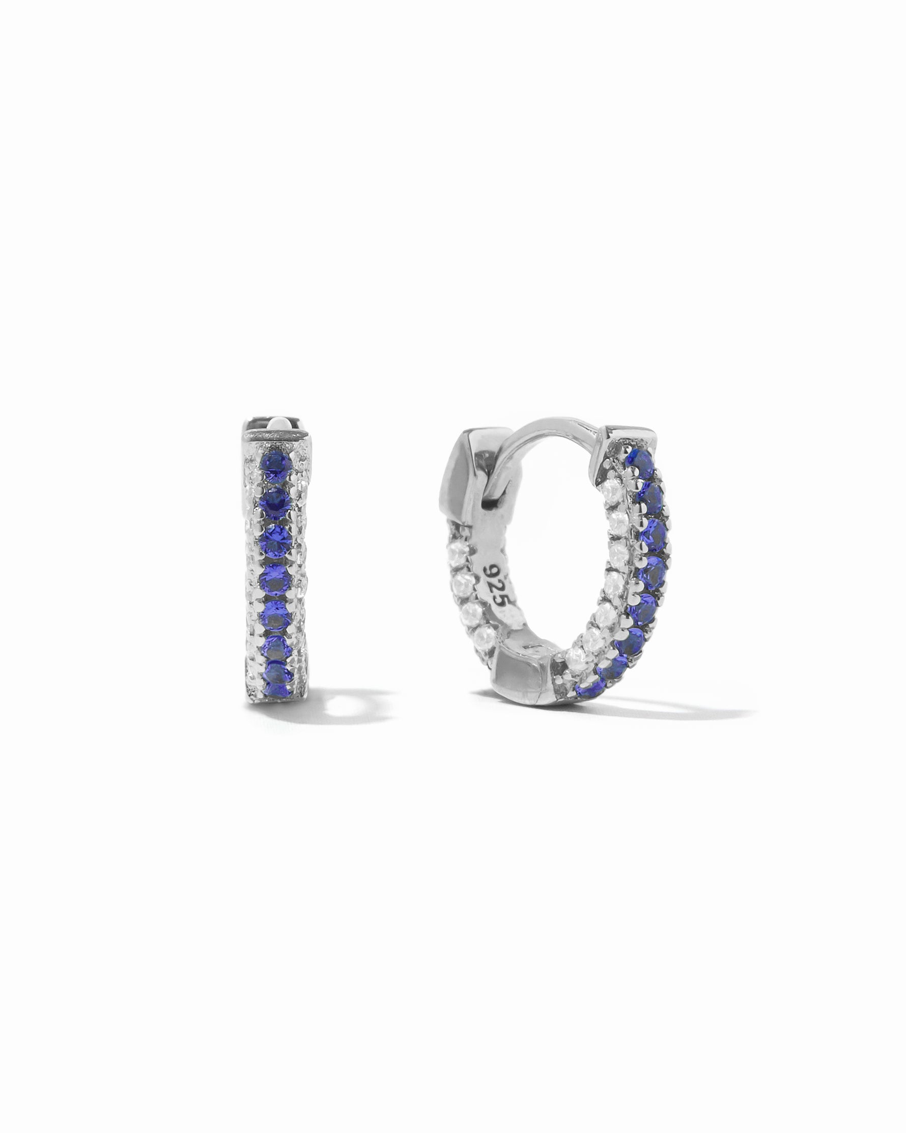 Sterling silver pavé huggies with Sapphire striped CZ's.