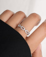 Sterling silver chain link ring with pave diamonds on model.