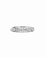 sterling silver ring with round stones made as a wedding band or stacking ring
