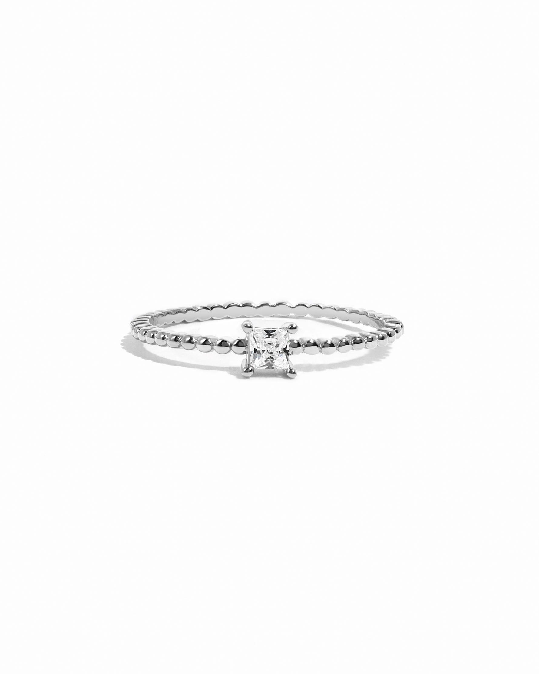 Sterling silver dainty princess cut diamond ring with beaded band.