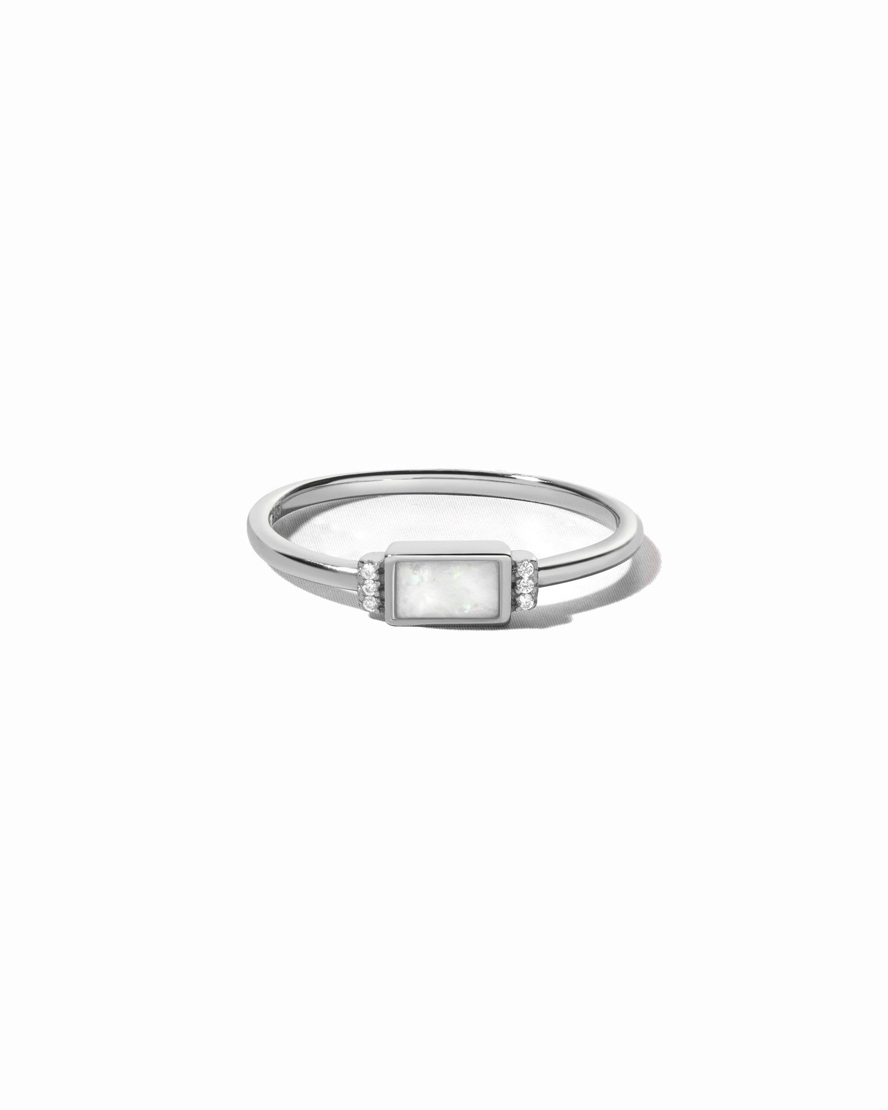 Sterling Silver opal baguette ring with side stones.