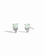 Tiny sterling silver and opal stud earrings with cubic zirconia.