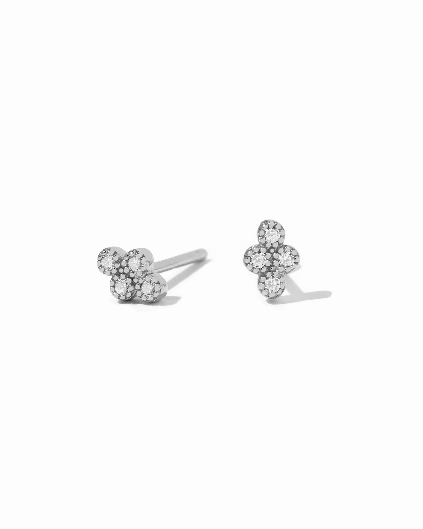 Dainty sterling silver diamond shaped studs with 4 diamond stones. 