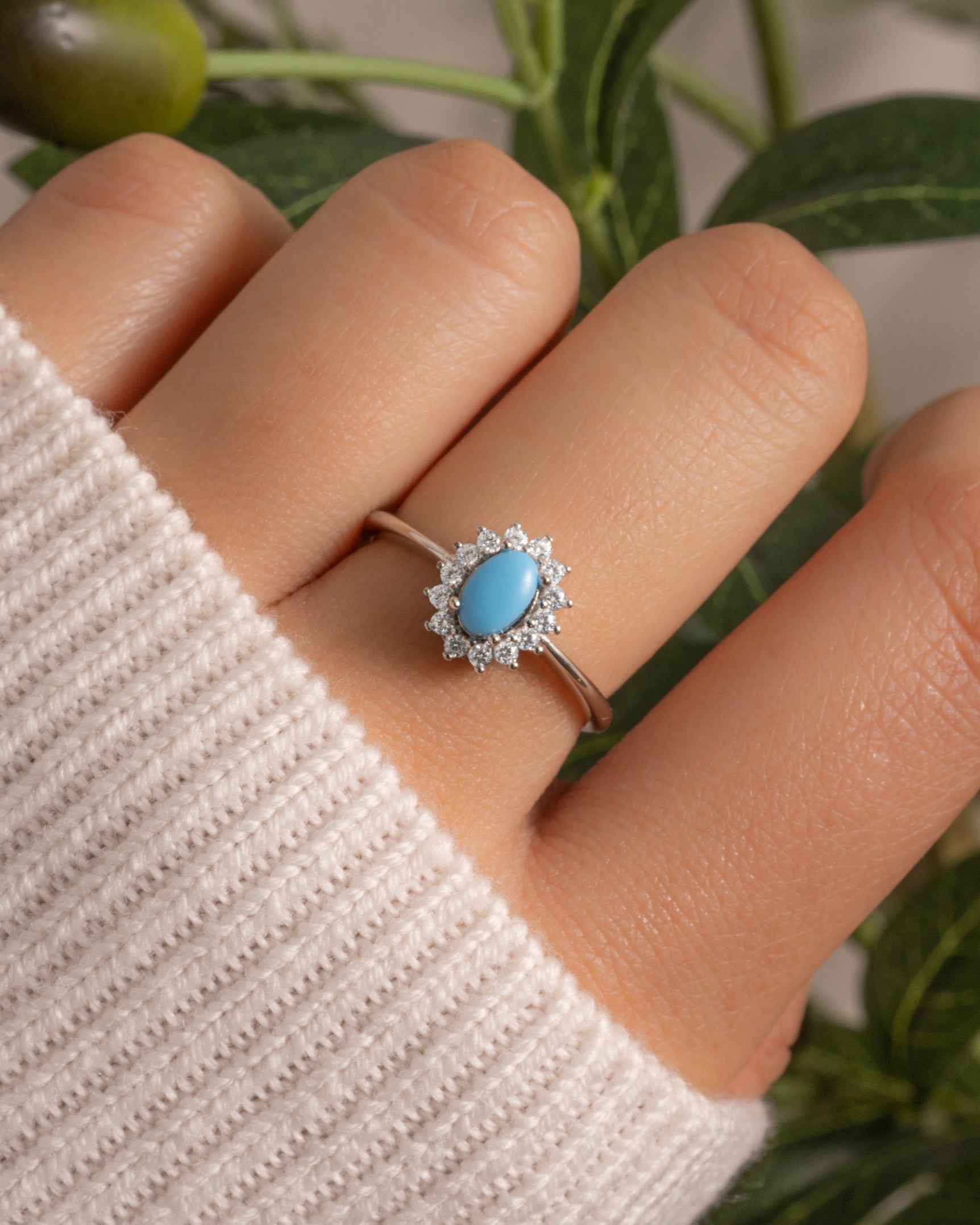 Sterling silver turquoise ring with diamond halo.