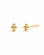 Dainty gold 4 ball studs.