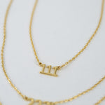 Upclose image of gold 111 angel number lucky number pendant necklace