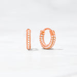 Rose gold diamond pave hoop earrings. 