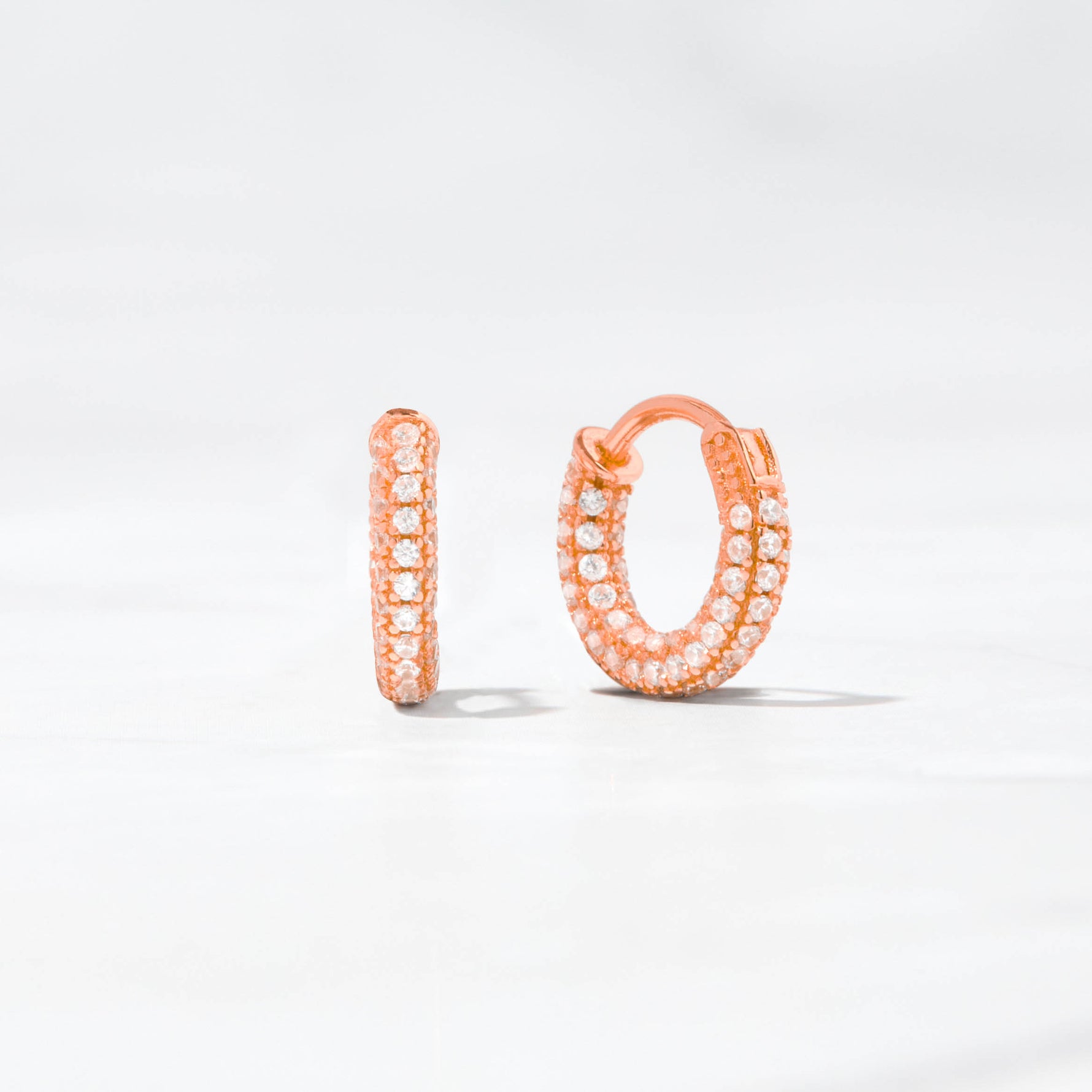 Rose gold diamond pave hoop earrings. 