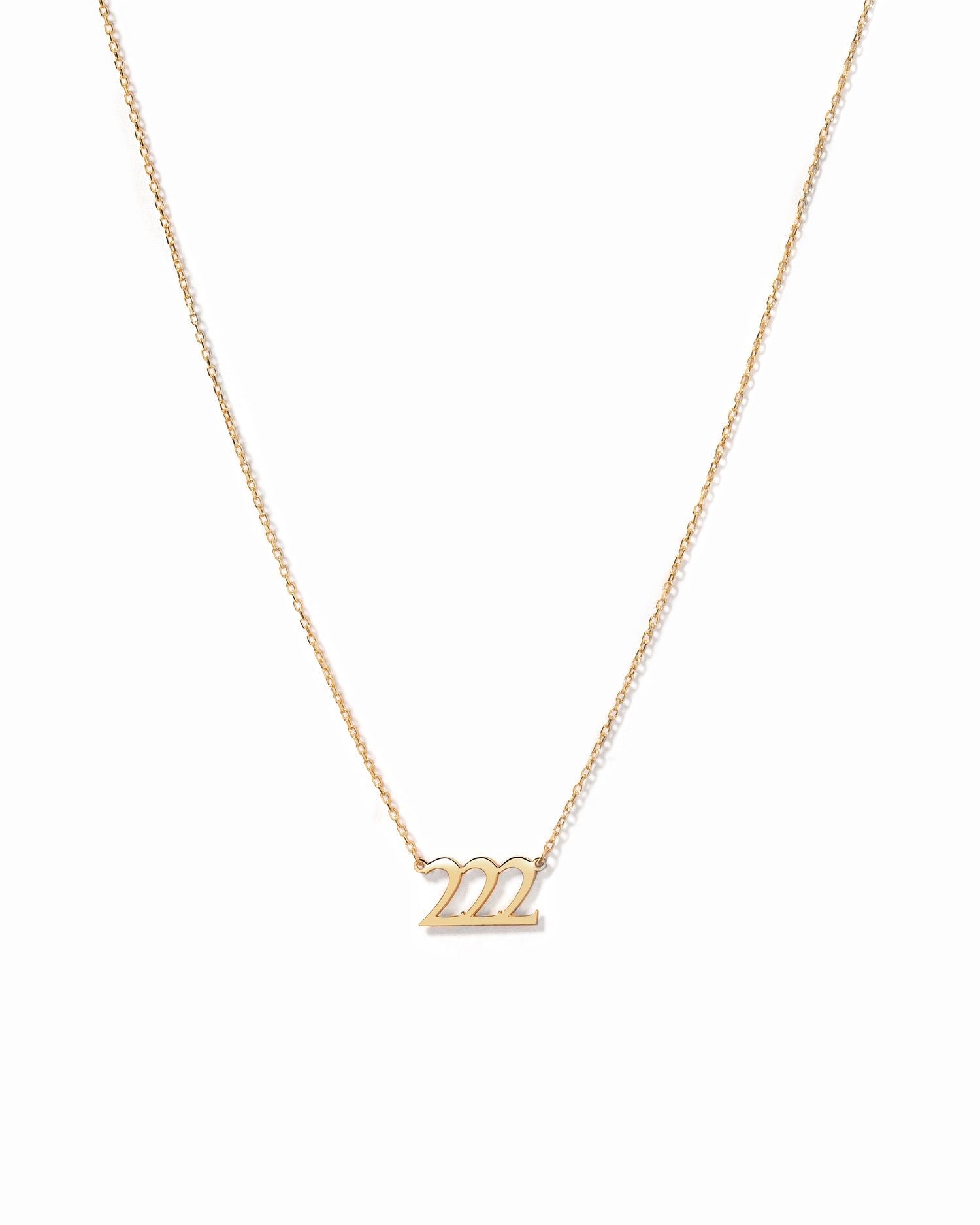 Dainty and minimalist gold 222 custom angel number necklace on white background