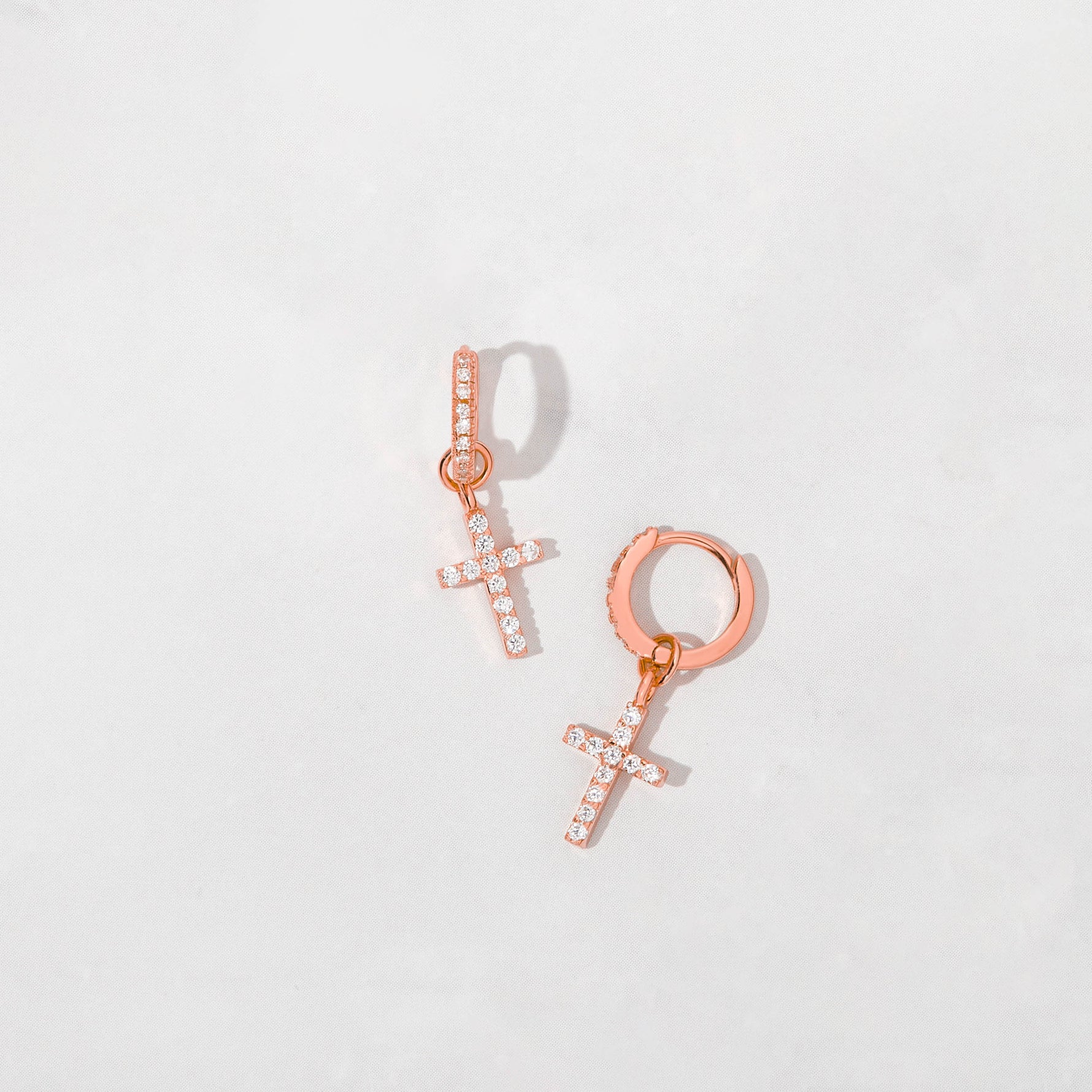 Rose gold cz studded cross charm huggies