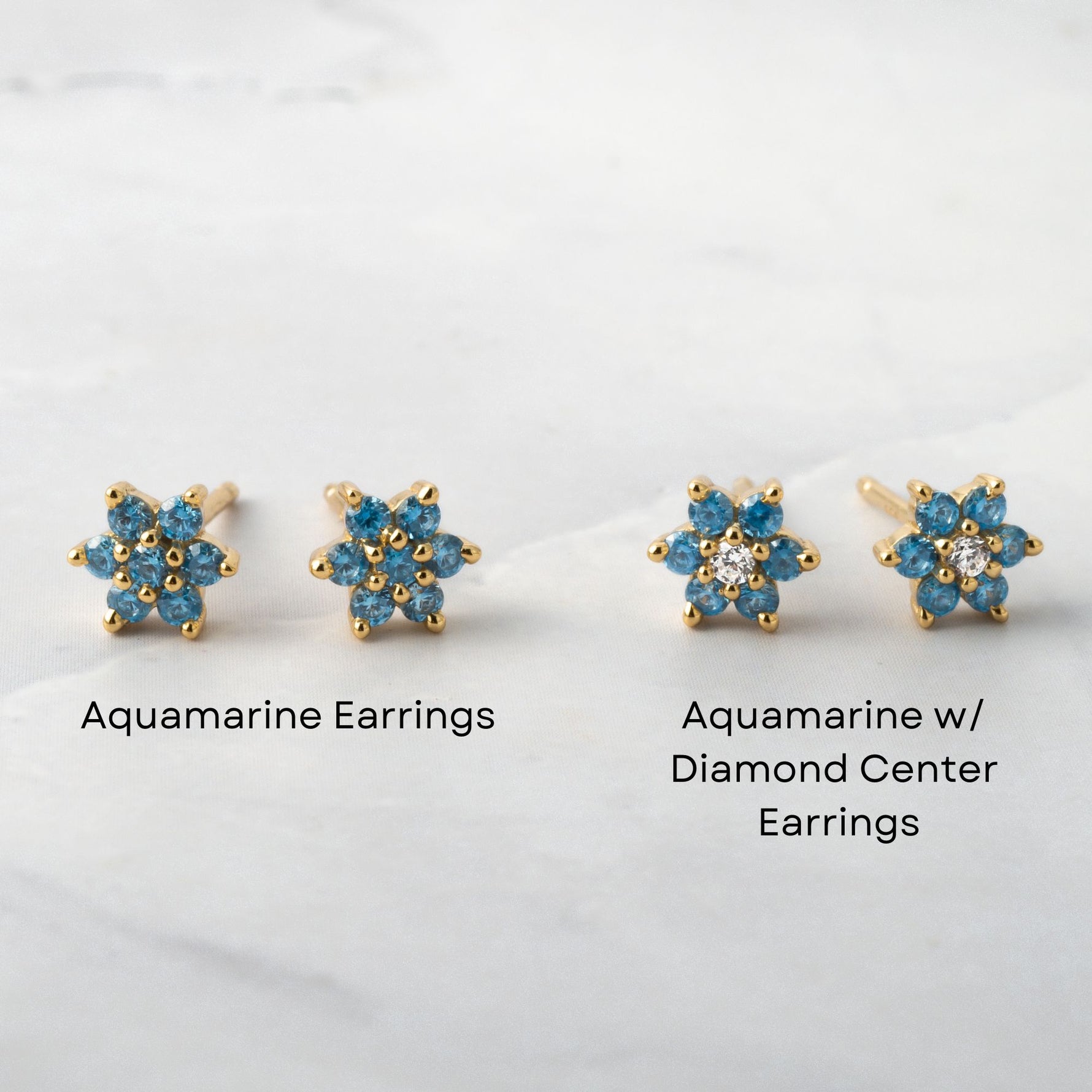 Aquamarine flower studs in solid gemstone and one with a diamond center. 