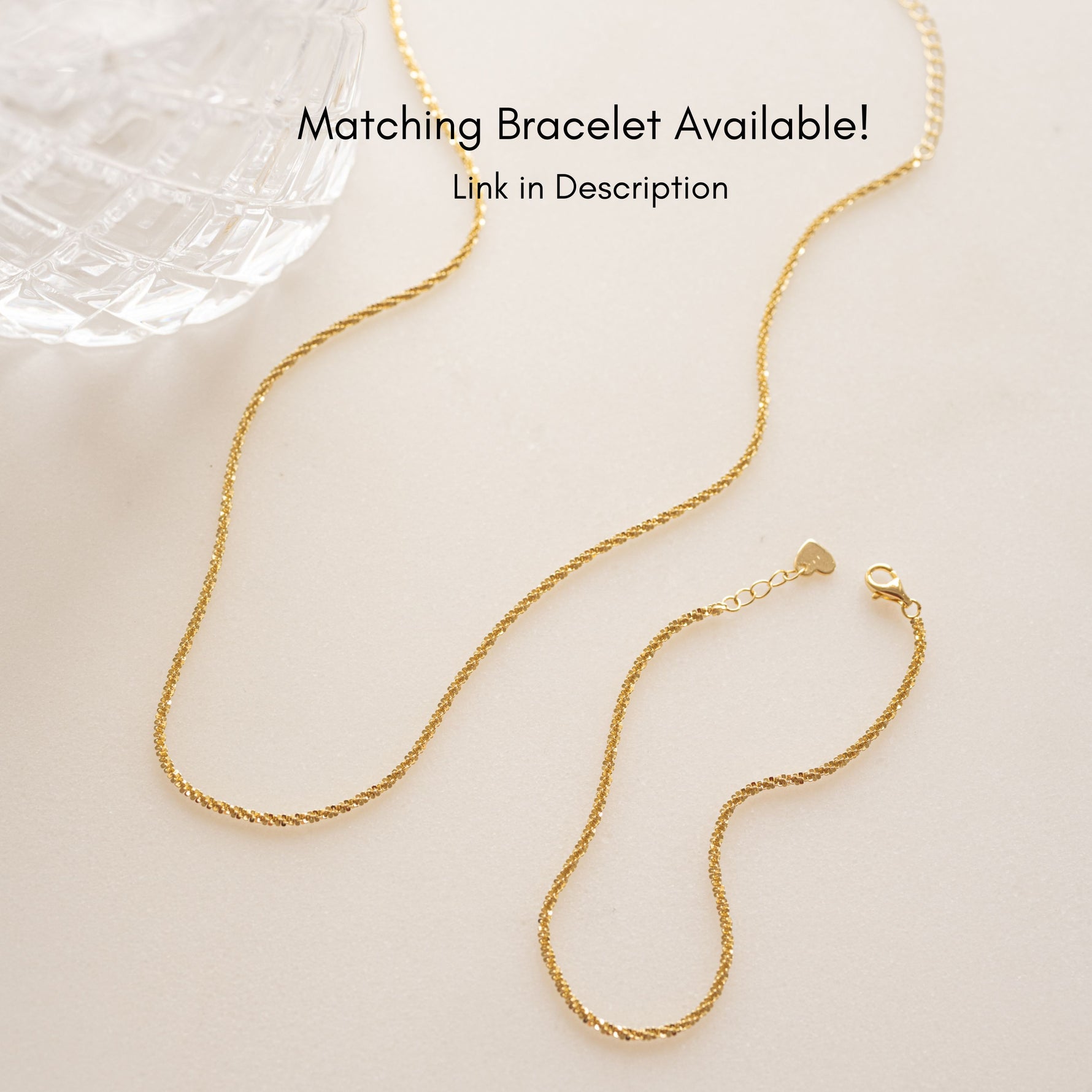 Gold diamond cut chain necklace with matching gold diamond cut bracelet. 