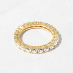 Gold cz diamond stacking ring on white background. 