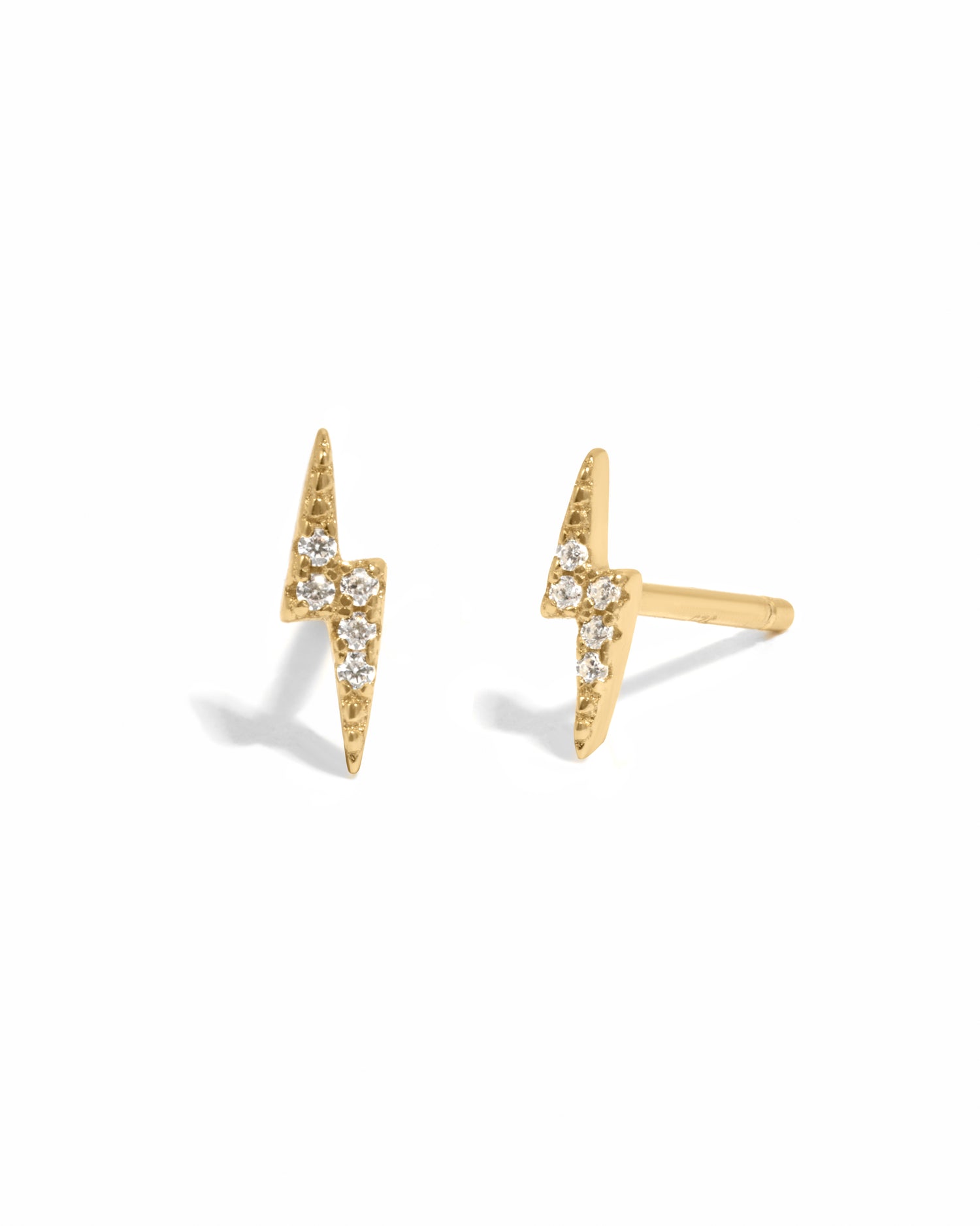 Dainty gold pavé studded lightning bolt stud earrings.